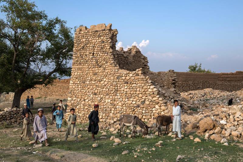 People have seen destruction throughout Afghanistan over the past decades. Chidlren pay here outside in Nangarhar's Achin district, destroyed by US airstrikes. 