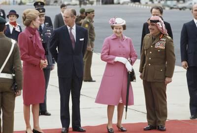 Queen Noor of Jordan, Prince Philip, Queen Elizabeth and King Hussein of Jordan after the British royals' arrival in the country in 1984.  Getty