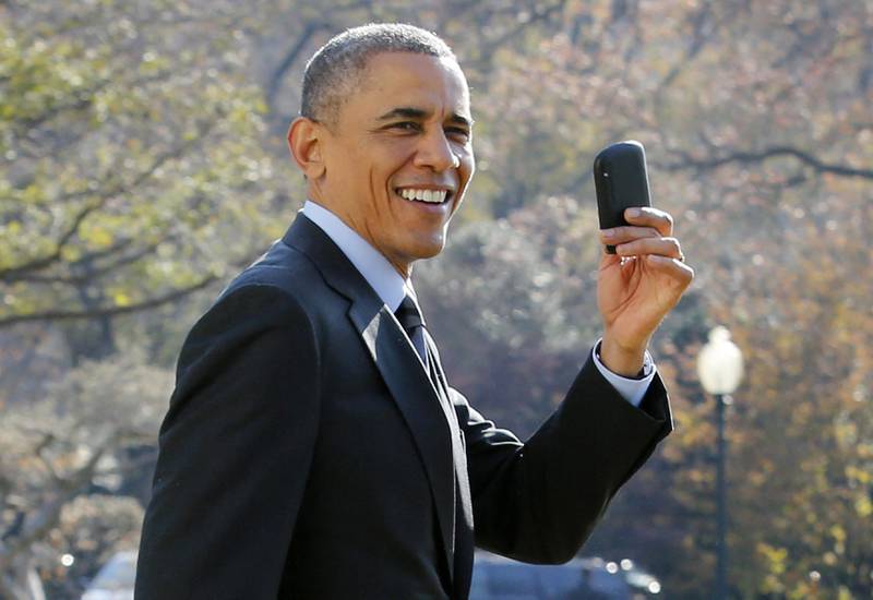 Barack Obama takes a stroll with his BlackBerry on the South Lawn of the White House in 2014. AFP