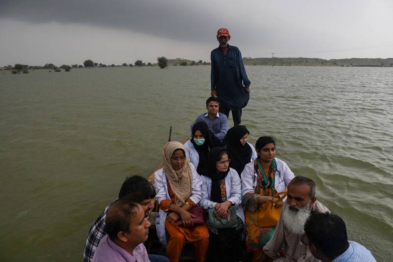 A team of doctors travels to flooded areas of Pakistan by boat. Reuters