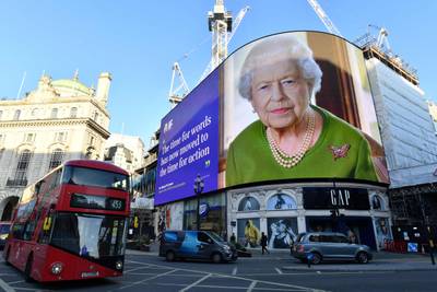 A quote from a message delivered by Britain's Queen Elizabeth to the Cop26 Summit taking place in Glasgow is displayed at Piccadilly Circus in London. AFP