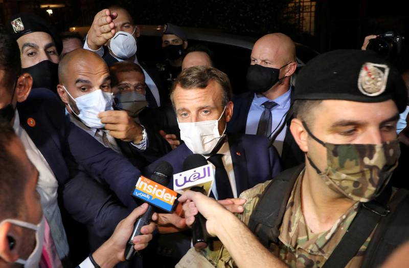 French President Emmanuel Macron talks to journalists as he leaves the home of Fairouz, one of Arab world's most famed singers, after visiting her in Rabieh, Lebanon, on August 31, 2020. Reuters