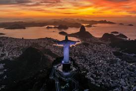 The sun rises in front of the Christ the Redeemer in Rio de Janeiro, Brazil. AFP