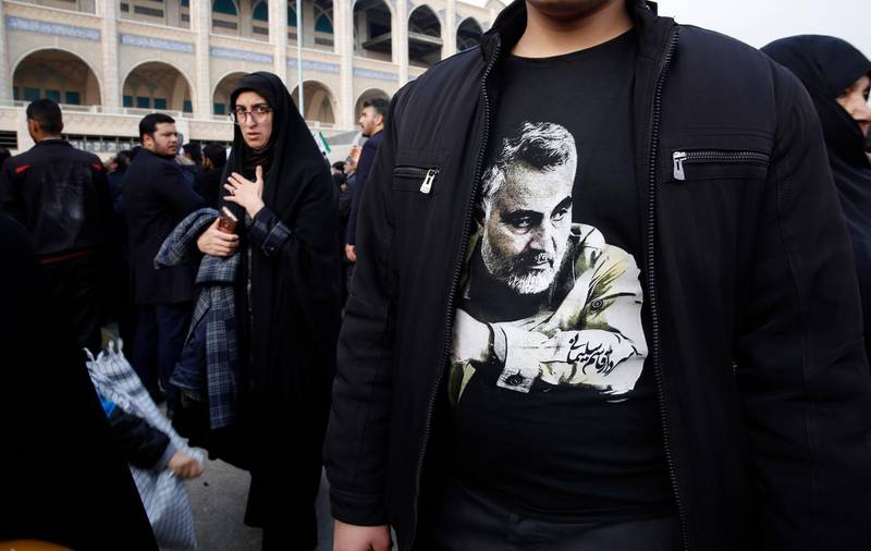 A man wearing a T-shirt with a picture of Suleimani takes part in an anti-US demonstration in Tehran. EPA