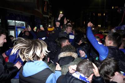 Chelsea fans celebrate outside their Stamford Bridge ground after beating Real Madrid 2-0 in their semi-final second leg and make the Champions League final where they will take on Manchester City. PA