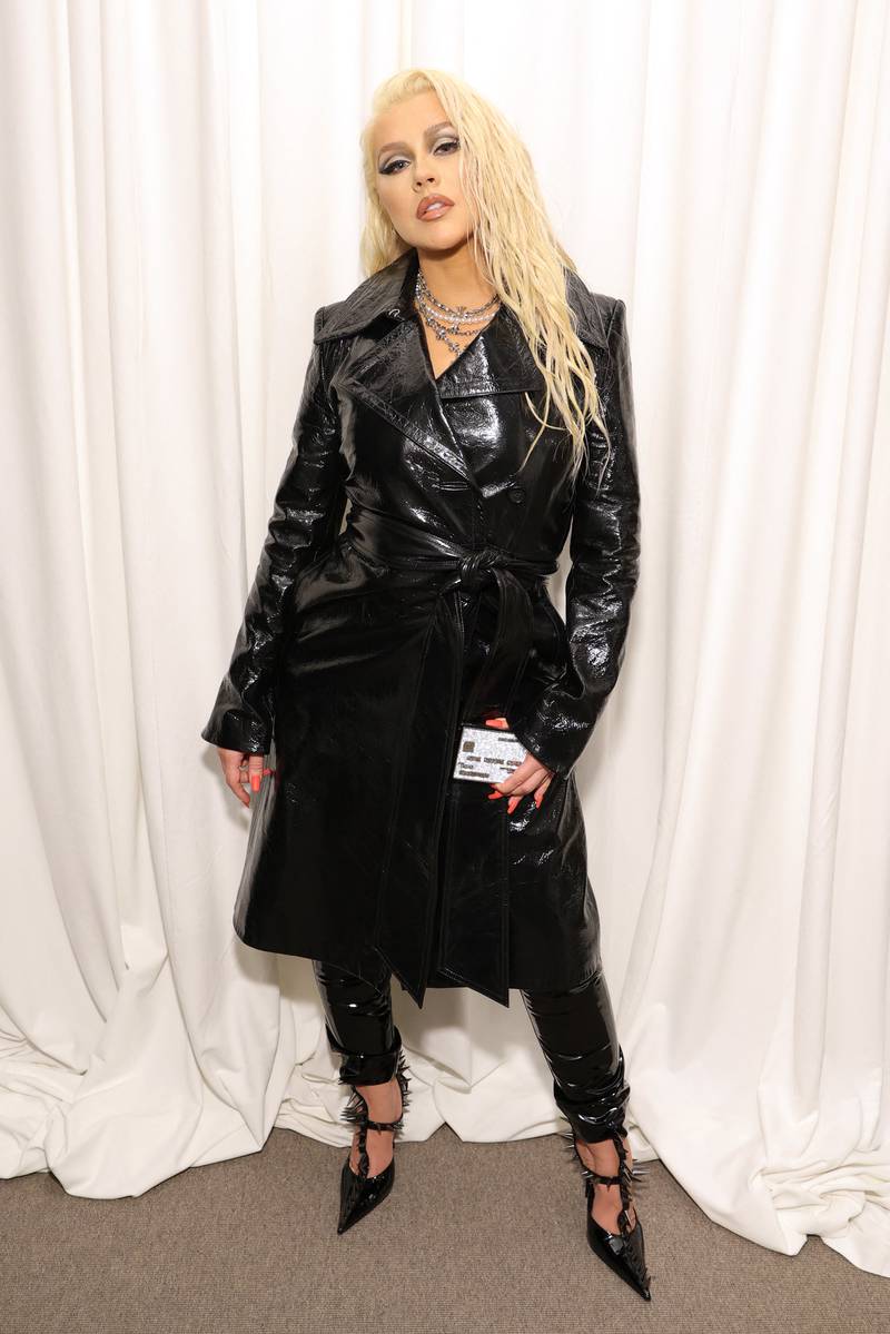 Christina Aguilera, wearing a black leather Helmut Lang trench coat over trousers, attends the MasterClass First Look Event at The Whitney Museum of American Art on November 10, 2021 in New York City. AFP