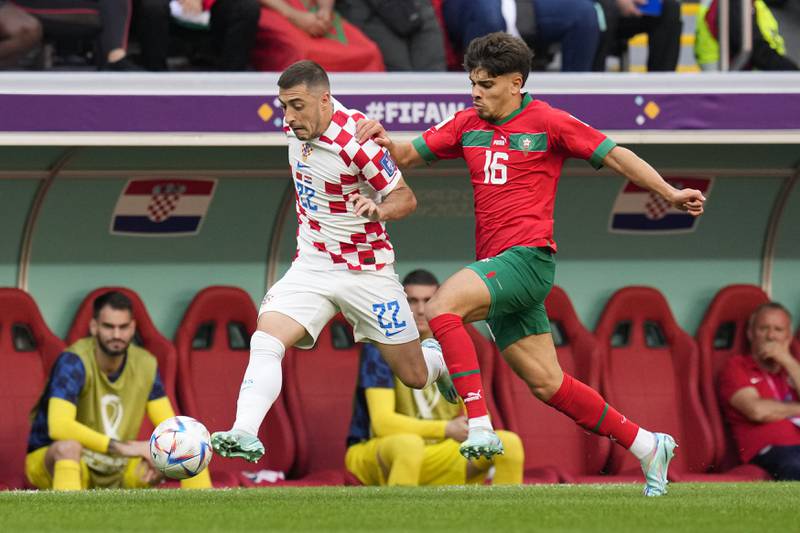 Croatia's Josip Juranovic, left, and Morocco's Abde Ezzalzouli fight for the ball during their World Cup match at the Al Bayt Stadium on Wednesday, November 23, 2022. AP