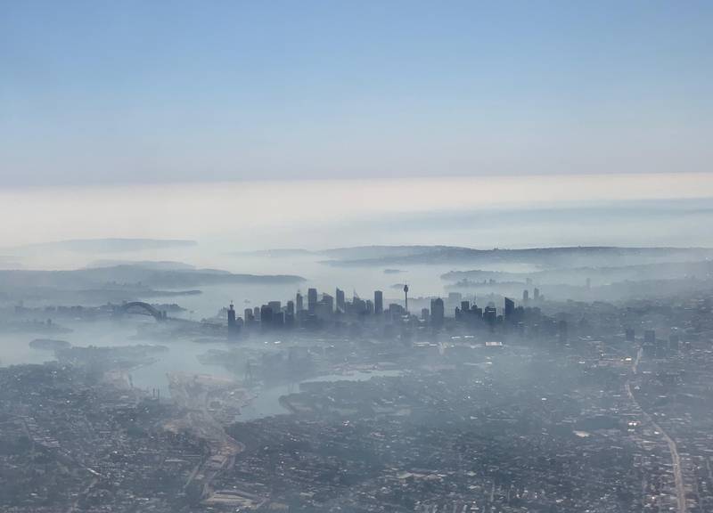 An image captured on a smart phone from a plane window displays smoke haze blanketing Sydney, Australia, November 19, 2019. AAP