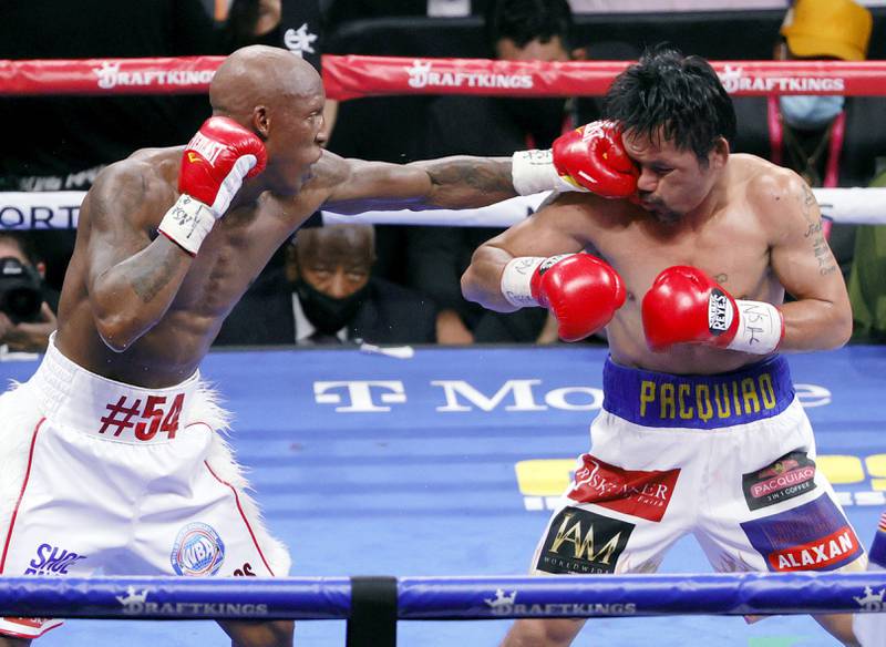 Yordenis Ugas lands a punch on Manny Pacquiao in the sixth round. AFP