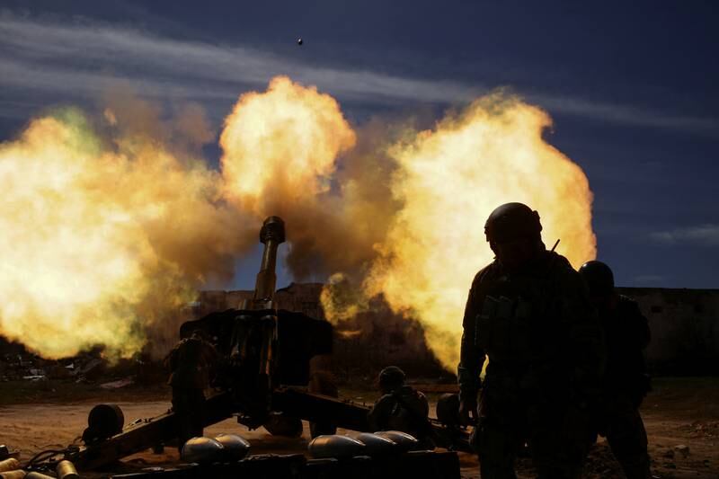 Members of the Ukrainian Volunteer Corps fire a howitzer at a position in the Zaporizhzhia region. Reuters