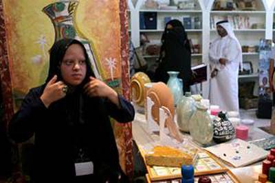 Badriyah Essah displays her handicrafts at the new shop in Al Arsa souk.