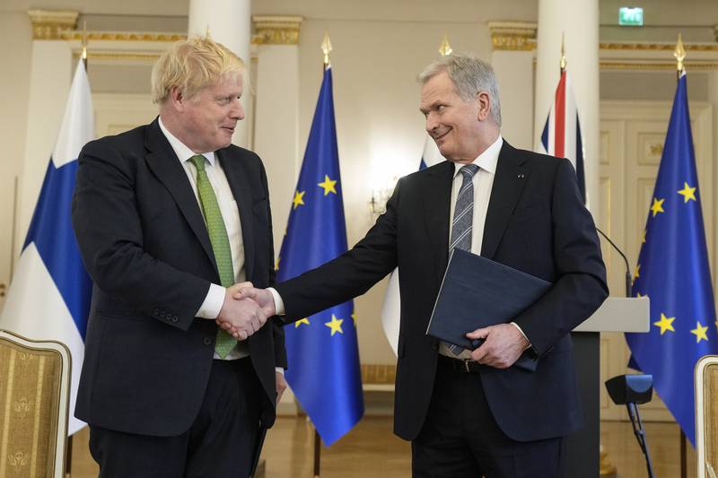 British Prime Minister Boris Johnson, left, and Finland's President Sauli Niinisto signed a security agreement at the Presidential Palace in Helsinki. AP Photo