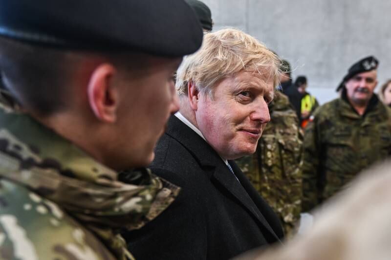UK Prime Minister, Boris Johnson speaks with Polish and British soldiers at the 1st Warsaw Armoured Brigade in Poland on February 10. Getty