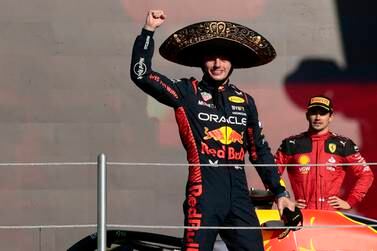 Dutch driver Max Verstappen of Red Bull Racing celebrates on the podium after winning the 2023 Formula 1 Grand Prix of Mexico City as third placed Charles Leclerc of Ferrari looks on, at Hermanos Rodriguez racetrack in Mexico City, Mexico, 29 October 2023.   EPA / Jose Mendez