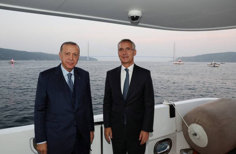 Turkish President Tayyip Erdogan and Nato Secretary General Jens Stoltenberg pose as they sail through Bosphorus in Istanbul. Reuters