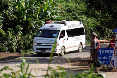 An ambulance believed to be carrying rescued schoolboys leaves from Tham Luang cave complex. Reuters