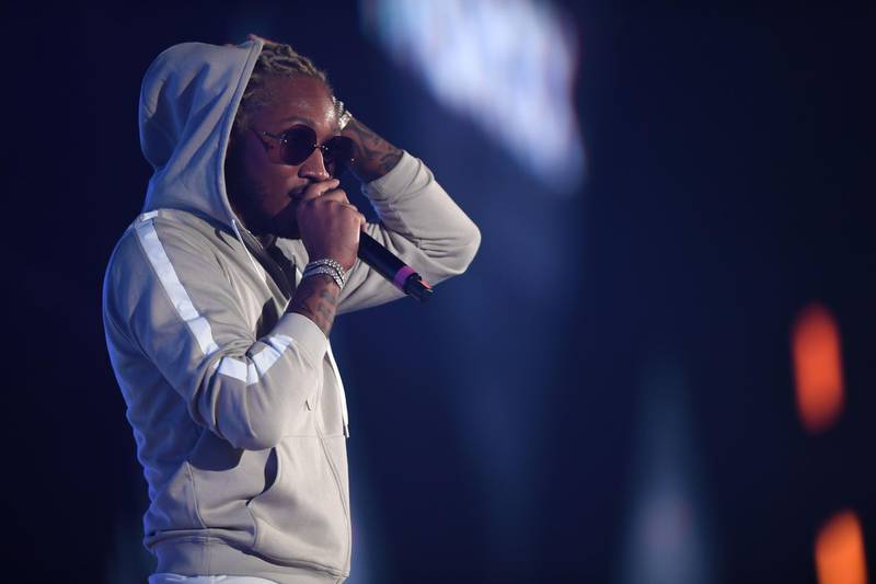 US rapper Future came on stage in Jeddah in sunglasses and a hoodie. / AFP / AMER HILABI
