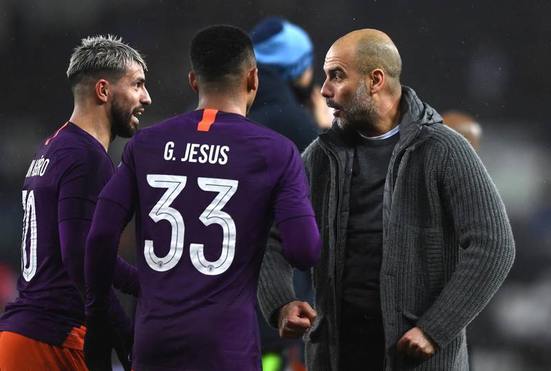 SWANSEA, WALES - MARCH 16: Josep Guardiola, Manager of Manchester City celebrates victory with Sergio Aguero and Gabriel Jesus of Manchester City following the FA Cup Quarter Final match between Swansea City and Manchester City at Liberty Stadium on March 16, 2019 in Swansea, United Kingdom. (Photo by Harry Trump/Getty Images)