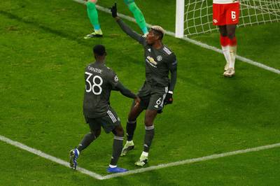 Pogba celebrates his goal with Axel Tuanzebe. AFP