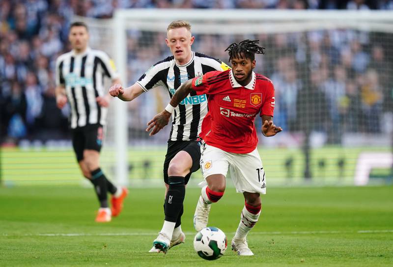 Manchester United's Fred and Newcastle United's Sean Longstaff battle. PA