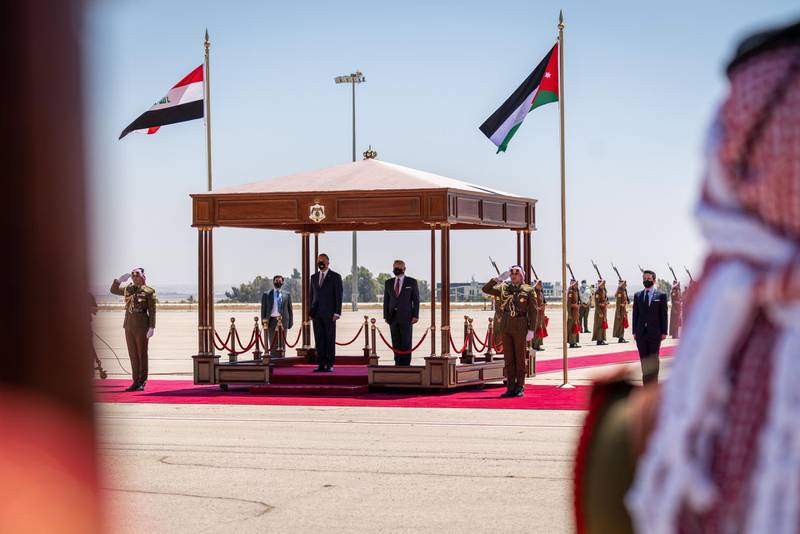 King Abdullah II of Jordan and Iraqi Prime Minister Mustafa Al Kadhimi in the official welcoming ceremony held at Queen Alia International Airport ahead of the trilateral meeting in Amman, Jordan, 25 August 2020.  EPA
