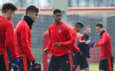 MANCHESTER, ENGLAND - FEBRUARY 24:  Marcus Rashford of Manchester United (39) warms up alongside team mates during a Manchester United training session ahead of their UEFA Europa League round of 32 second leg match against FC Midtjylland at the Aon Training Complex on February 24, 2016 in Manchester, United Kingdom.  (Photo by Jan Kruger/Getty Images)