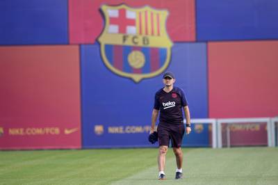 Barcelona coach Ernesto Valverde lays out cones. AFP