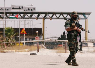 A Syrian soldier is seen standing in the Nasib border crossing with Jordan in Deraa, Syria July 7, 2018.REUTERS/ Omar Sanadiki