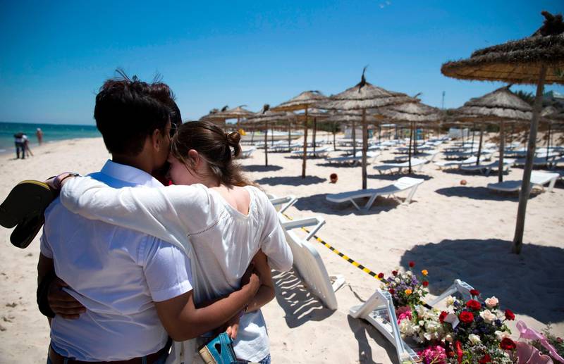 (FILES) In this file photo taken on June 27, 2015, people react at the site of a shooting attack on the beach in front of the Riu Imperial Marhaba Hotel in Port el Kantaoui, on the outskirts of Sousse south of the capital Tunis. A Tunisian court was poised to give verdicts on February 8, 2019, in the trials of suspects in deadly jihadist attacks on the Tunsian capital's Bardo museum and on a beach in the tourist resort of Sousse, lawyers told AFP.
On June 26, 2015 a shooting rampage in Sousse killed 38 people, most of them British tourists. / AFP / Kenzo TRIBOUILLARD
