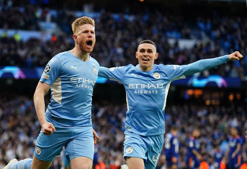 Manchester City's Kevin De Bruyne celebrates scoring with Phil Foden. PA