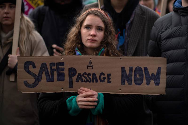 A protester at a demonstration against the British government's policy on migration. The rally was outside Downing Street on November 27, 2021, three days after the deaths of at least 27 migrants.  AFP