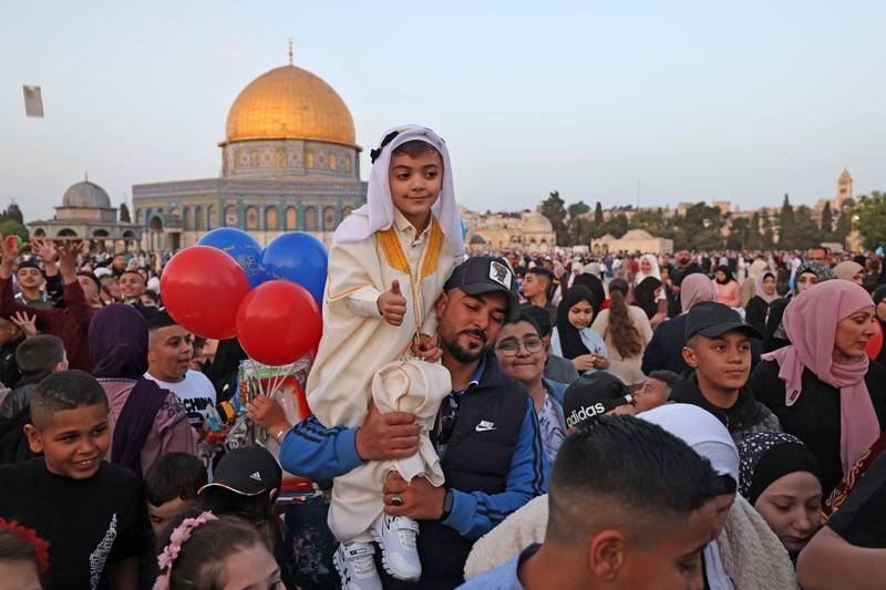 Muslim celebrate the end of this year's Ramadan in front of the Dome of the Rock mosque. AFP