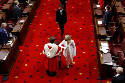 Canada's Governor General Julie Payette, followed by Prime Minister Justin Trudeau, bumps elbows with Chief Justice Richard Wagner as she arrive to deliver the Throne Speech in the Senate, as parliament prepares to resume in Ottawa, Ontario, Canada. Reuters