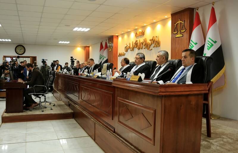 Judge Jassim Mohammed Aboud, head of the Iraqi Federal Supreme Court, centre, and other judges attending a session in Baghdad in December 2021. EPA