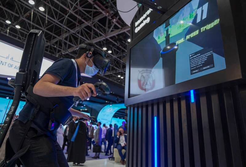 A man using an AR headset at the Du stand on the second day of Gitex.