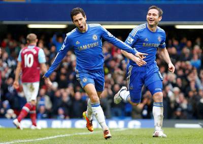 FILE PHOTO: Eden Hazard of Chelsea (L) celebrates scoring against West Ham next to team mate Frank Lampard during their English Premier League soccer match at Stamford Bridge in London, March 17, 2013.  REUTERS/Andrew Winning (BRITAIN)/File Photo
