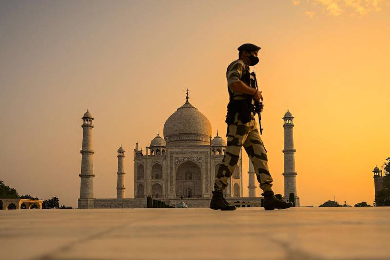 An Indian soldier patrols the Taj Mahal after it reopened to visitors following the easing of Covid-19 restrictions. AFP