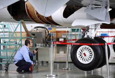 A technician inspects an ARJ21-700 aircraft at the Comac factory in Shanghai. China launched the ARJ21 project in 2002 in an attempt to break into the Western-dominated aircraft market and is targeting the domestic market and flights to Southeast Asia. Carlos Barria / Reuters