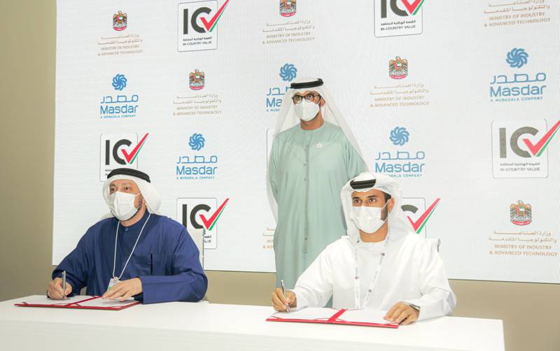 Dr Sultan Al Jaber witnesses the signing of a preliminary agreement by Mohamed Al Ramahi and Abdullah Al Shamsi. Photo: Masdar