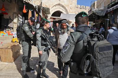 Israeli security forces check Palestinians going into Al Aqsa Mosque for Friday prayers on the eve of Ramadan. AFP