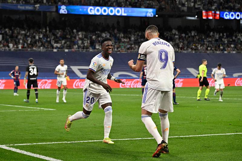 Vinicius Junior celebrates with Karim Benzema after scoring the fifth goal. AFP