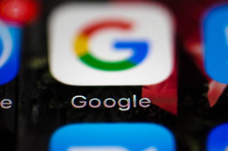FILE  - This Wednesday, April 26, 2017 file photo shows a Google icon on a mobile phone, in Philadelphia. European Union antitrust chief Margrethe Vestager is planning a statement on Wednesday, July 18, 2018 amid reports that her office will slap a record $5 billion fine on Google for abuse of its dominant position in the Android mobile phone operating systems. The decision was widely expected this week and financial media, including Bloomberg and the Financial Times, said the amount would total 4.3 billion euros. (AP Photo/Matt Rourke, File)