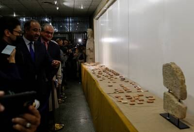 Iraqi Culture Minister Hassan Nadhim looks at ancient artefacts handed over by Lebanon to Iraq on display at the National Museum in Baghdad on February 8, 2022. Reuters