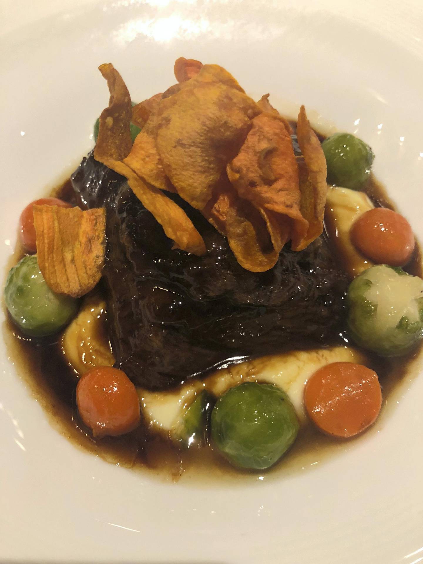 The braised short rib with potato puree, pulled beef and carrot crisp (Dh165) is one of the signature dishes at Hell's Kitchen Dubai. Melinda Healy