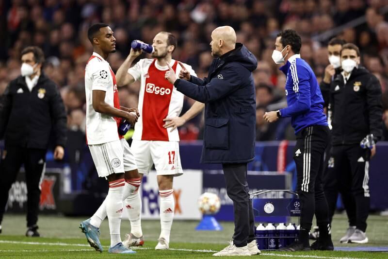 Erik ten Hag, passes on instructions to his Ajax players Ryan Gravenberch and Daley Blind during the Champions League last-16 match against Benfica at the Johan Cruijff ArenA in Amsterdam, Netherlands, 15 March 2022. EPA