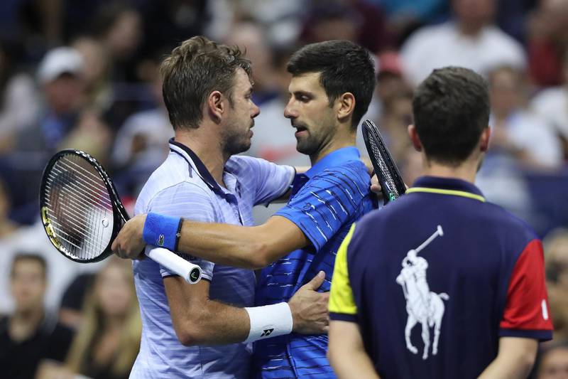 NEW YORK, NEW YORK - SEPTEMBER 01: Novak Djokovic (R) of Serbia embraces Stan Wawrinka (L) of Switzerland after Djokovic retired due to a shoulder injury during their Men's Singles fourth round match on day seven of the 2019 US Open at the USTA Billie Jean King National Tennis Center on September 01, 2019 in Queens borough of New York City.   Matthew Stockman/Getty Images/AFP
== FOR NEWSPAPERS, INTERNET, TELCOS & TELEVISION USE ONLY ==
