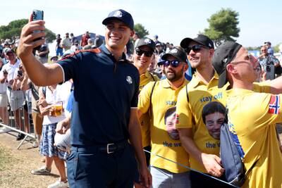 Europe's Ludvig Aberg poses for a selfie with fans during a practice round prior to the 2023 Ryder Cup at Marco Simone Golf Club. Getty