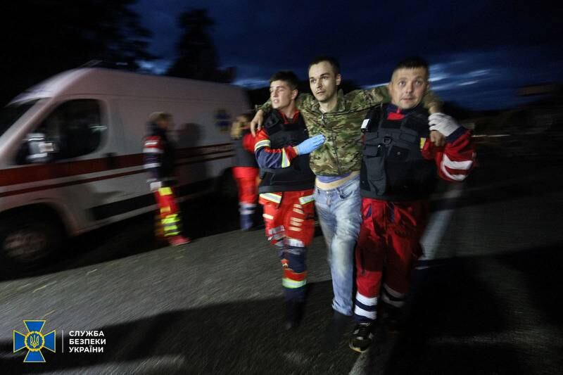 Paramedics help one of the freed Ukrainians. Reuters