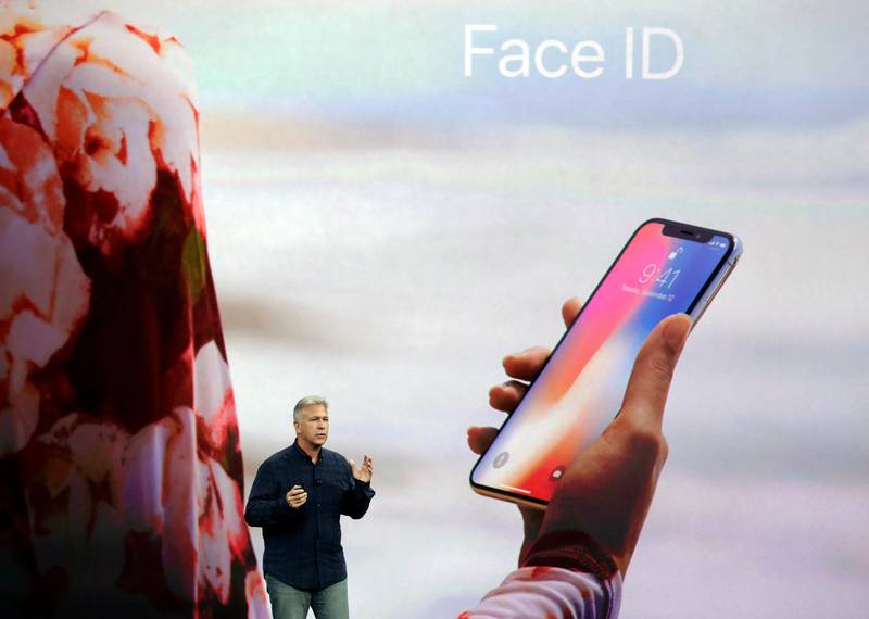 FILE - In this Tuesday, Sept. 12, 2017, file photo, Phil Schiller, Apple's senior vice president of worldwide marketing, announces features of the new iPhone X, including Face ID, at the Steve Jobs Theater on the new Apple campus, in Cupertino, Calif. Face ID, Appleâ€™s name for its facial-recognition technology, replaces the fingerprint sensor found on other models. (AP Photo/Marcio Jose Sanchez, File)