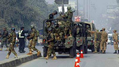 Pakistani army troops arrive to conduct an operation at a school under attack by Taliban gunmen in Peshawar. Taliban gunmen stormed a military school in the northwestern Pakistani city, killing and wounding dozens, officials said, in the latest militant violence to hit the already troubled region. Mohammad Sajjad / AP Photo
